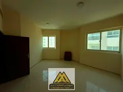 Two-bedroom apartment for annual rent in Al Nakhil, Ajman. Central AC, one bathroom, near Corniche. 