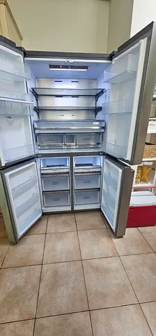 Spacious stainless steel 4-hisance door refrigerator - good working condition
