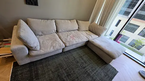 Excellent condition pan Emirates Pianca Modern feather filled sofa with footstool