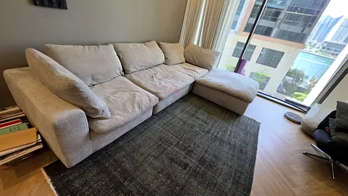 Like a brand new condition Pan Emirates Pianca Modern feather filled sofa with footstool