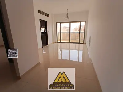 2BR in Al Aaliah, new family building, balcony, central AC, AED 39,997, 4 cheques.