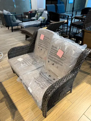 Brown Wicker Outdoor Patio Loveseat with Beige Cushions