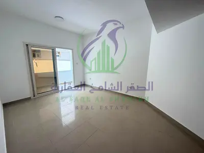 Two Bedrooms And Two Halls Apartment For Rent In Al Nahda With Two Kitchens A Balcony Built In Wall Cabinets And Two Bathrooms