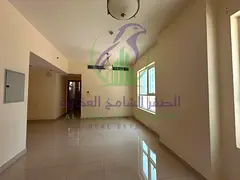 Spacious Two Bedroom Apartment with Balcony and Parking with Built in Wardrobes in Prime close to Du