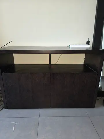 Compact dark wood cabinet with bookshelves and wine storage