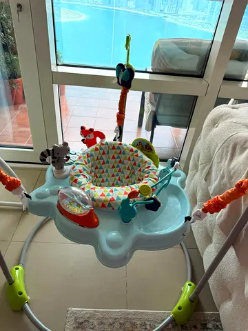 Baby jumper activity center with toys - gently used