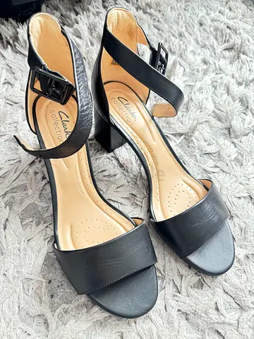 Black Clarks women's ankle-strap sandals - size not specified, gently used