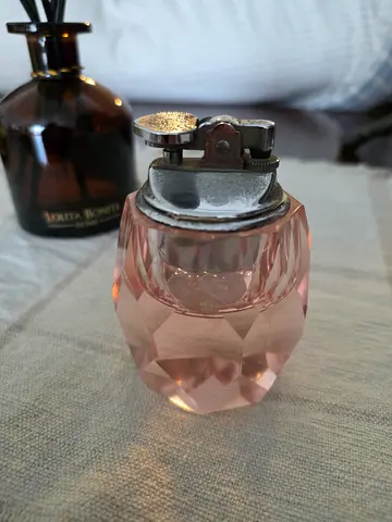 vintage 1960s–1970s diamond-faceted pink glass table lighter.