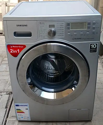 Samsung 8kg front load washing machine with 5kg full dryer, silver color, good condition.