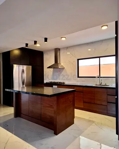 Modern wooden kitchen island with cabinets and black granite countertop