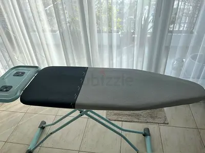 Ironing board with built-in iron rest — good condition very strong heavy duty