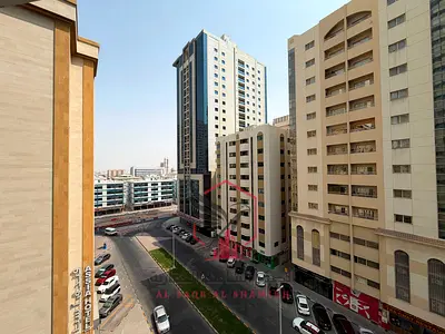 Cheapest spacious 2-bedroom apartment with free A/C by the landlord, balcony with open city view, and built-in wardrobes.