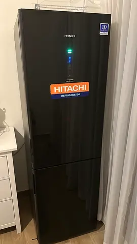 Black colour bottom freezer refrigerator neat and clean condition