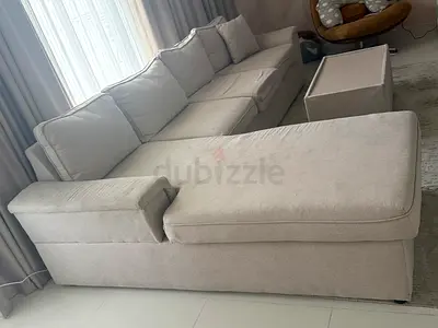 L shaped sofa with center table