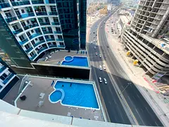 Annual rental opportunity in Ajman, Al Rashidiya 1 Oasis Towers A prime two-bedroom apartment with a