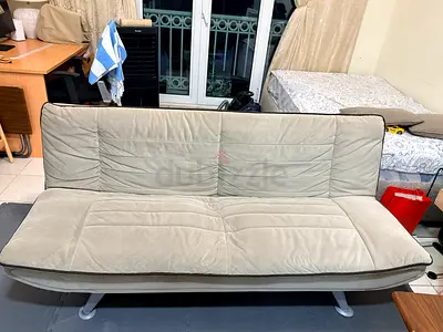 Light beige convertible futon sofa bed — good condition