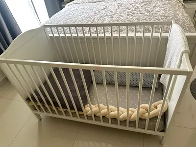 White wooden baby crib / cot in good condition