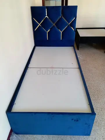 Single blue velvet bed frame with tufted headboard