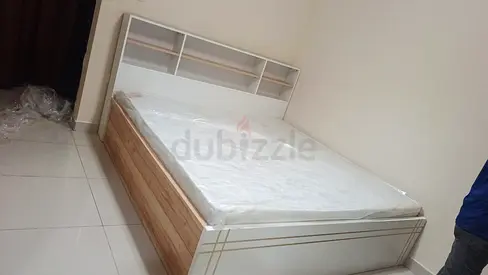 King size storage bed with headboard shelving — good quality