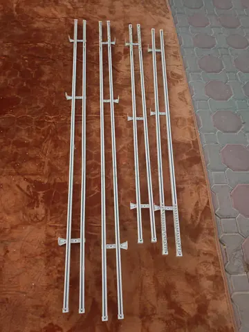 Set of metal curtain rods/tracks with brackets - used
