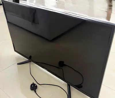 35-inch LED TV in good working condition with stand and power cable