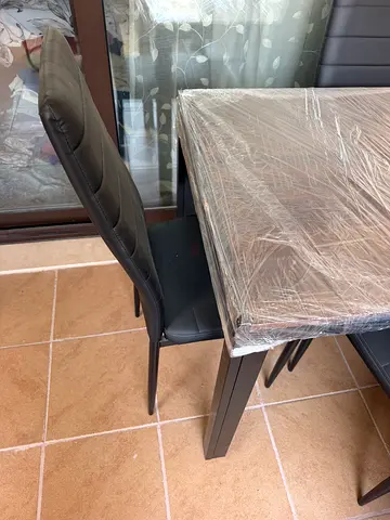 Wooden dining table with chairs - good condition.