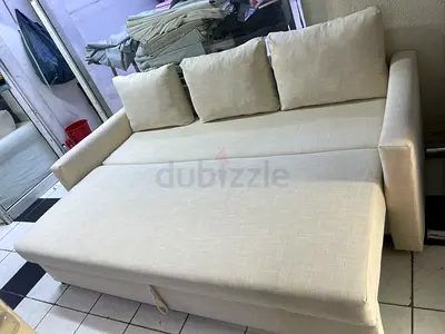 Comfortable Beige Pull-out Sofa Bed with Cushions