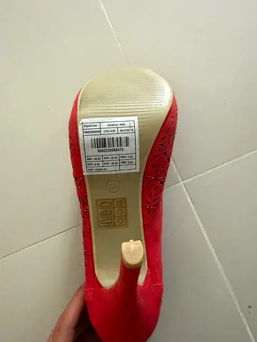 Red suede high heel pump - single/used, size visible on sole