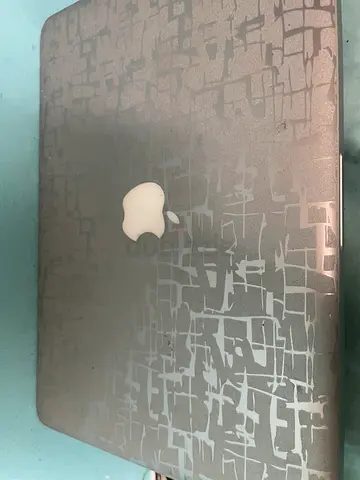 Used Apple MacBook (Silver) with protective skin - good condition