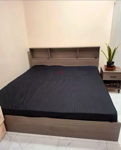 King Size storage bed with headboard shelves - good condition from Danube Home at only AED 250