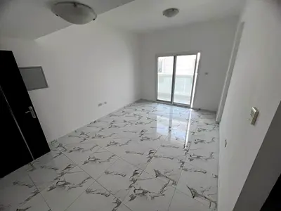 A second-occupancy 1-bedroom apartment for annual rent in Al Rashidiya 2, ideally located near Ladi