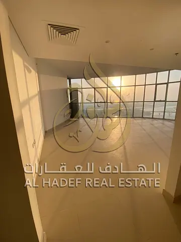 An apartment in Al Majaz 1, situated in a very high-end building, featuring a full panoramic view of the lake. It comprises three bedrooms and a spaci
