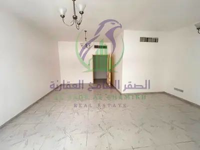 Two bedroom apartment with living room for annual rent in Al Nahda Emirate of Sharjah large hallway balcony open view spacious areas modern finishes p