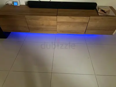 Wall-mounted wooden entertainment unit with LED lighting