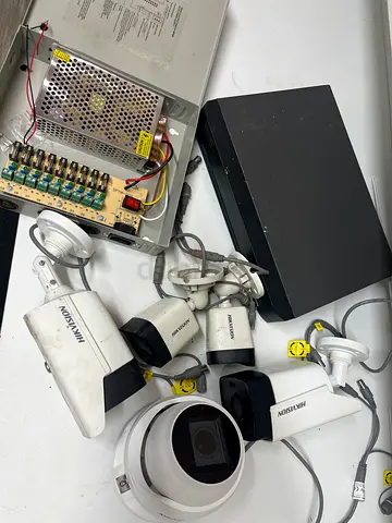 Hikvision CCTV kit — 4 bullet cameras + 1 dome, DVR, power box (used)