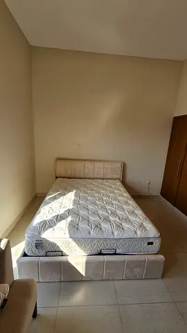 Queen upholstered bed frame with mattress - good condition