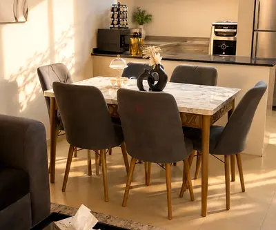 Marble-top dining table with 6 grey upholstered chairs - excellent condition