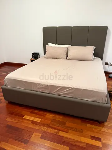 King-size upholstered platform bed with padded headboard - good condition