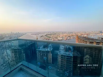 Two bedrooms and a living room for annual rent in Al Waha Towers Ajman, high floor with full sea view, 2 balconies, gym, swimming pool and parking, pr
