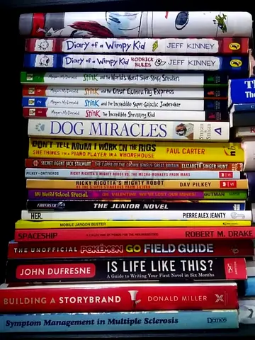 Mixed collection of children's and nonfiction books — Diary of a Wimpy Kid, Stink, Dog Miracles,