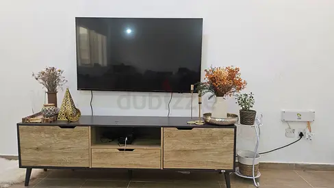 Modern low TV cabinet / entertainment unit in wood finish
