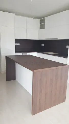 Modern white kitchen with wooden island - like new