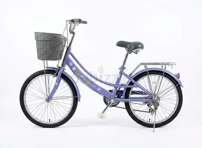Purple step-through city bike with front basket and rear rack - good condition