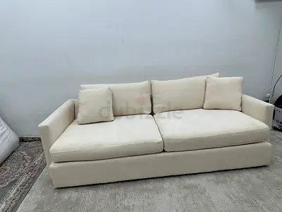 Beige color crate&barrel three seater sofa