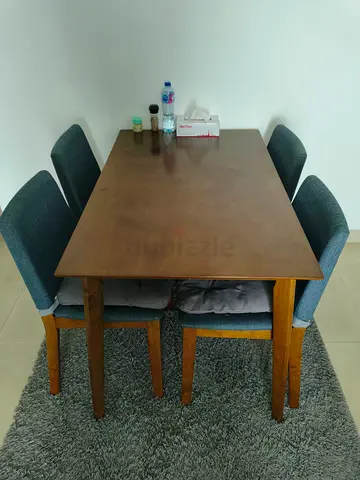 Wooden dining table with 4 upholstered chairs