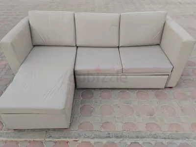 Light beige L-shaped sofa with chaise — good condition