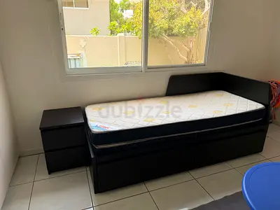 Single daybed with trundle drawers and matching bedside table - dark wood