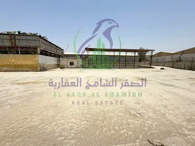 حوش صناعي واسع للإيجار السنوي بمساحة 15000 قدم مربع مع مكتب وسكن للعمال مناسب لمختلف الأنشطة التجارية والصناعية
