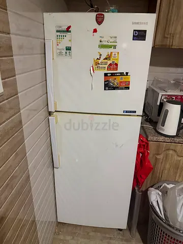 Samsung double-door refrigerator, used, needs minor cosmetic touch-ups