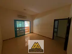 Two-bedroom apartment for annual rent in Al Nakhil, Ajman. Ground floor, balcony, split AC, near Ajm